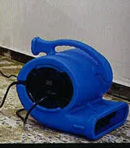 A blue drying fan used after water damage